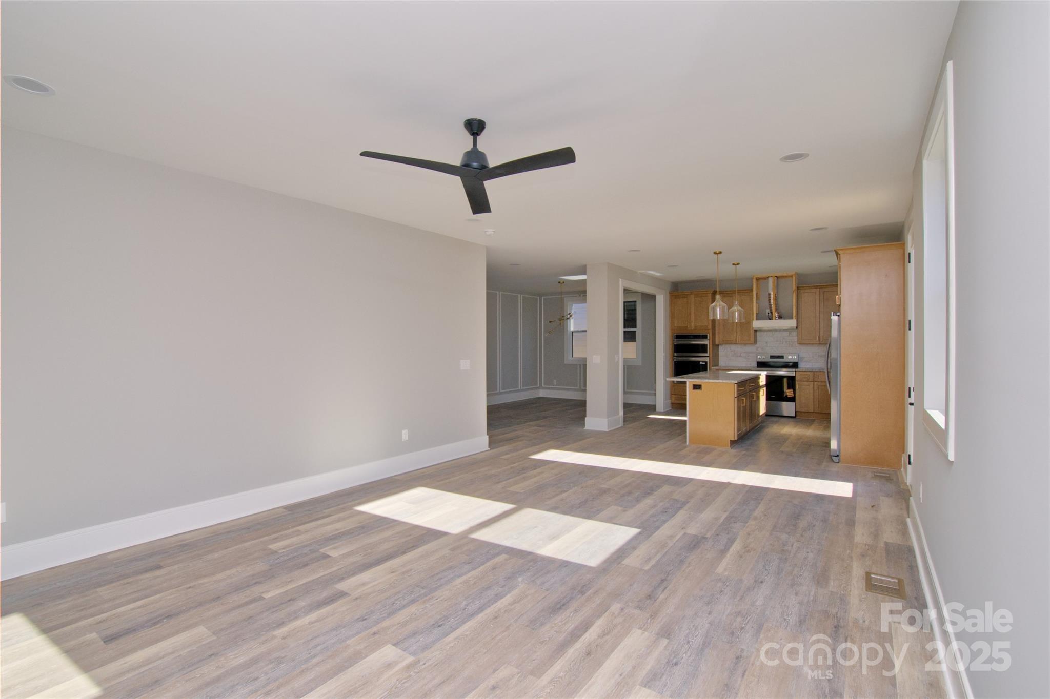 3905 Plainview Road Charlotte, NC 28208 - Photo 18 of 45 a view of a kitchen with wooden floor and a kitchen