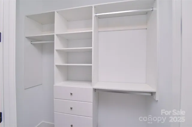 a view of an empty walk in closet