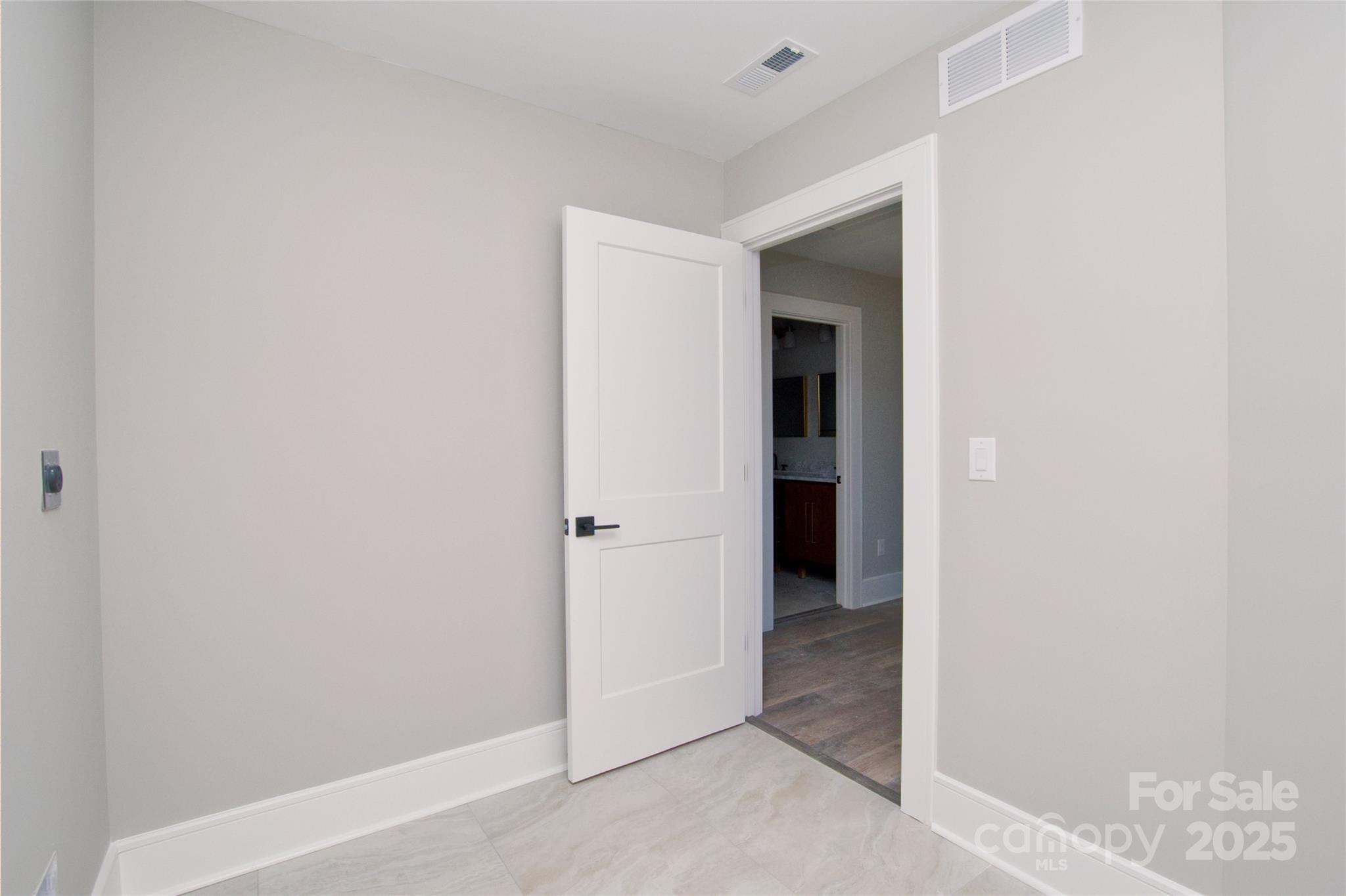 3905 Plainview Road Charlotte, NC 28208 - Photo 24 of 45 a view of an empty room with closet and a window