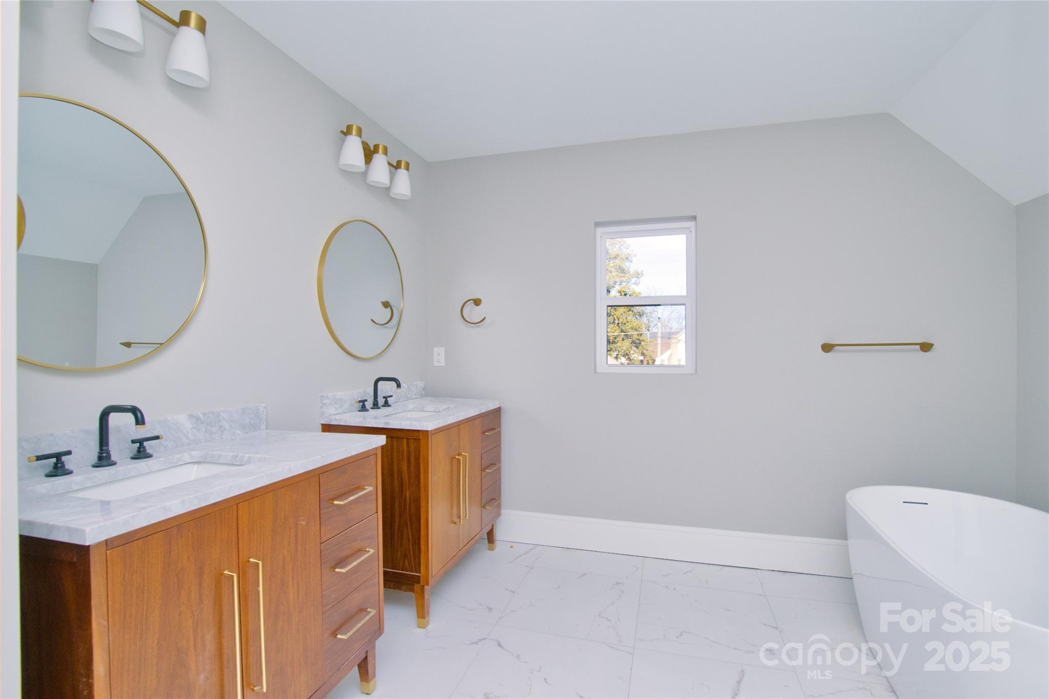 3905 Plainview Road Charlotte, NC 28208 - Photo 27 of 45 a bathroom with a double vanity sink mirror and toilet