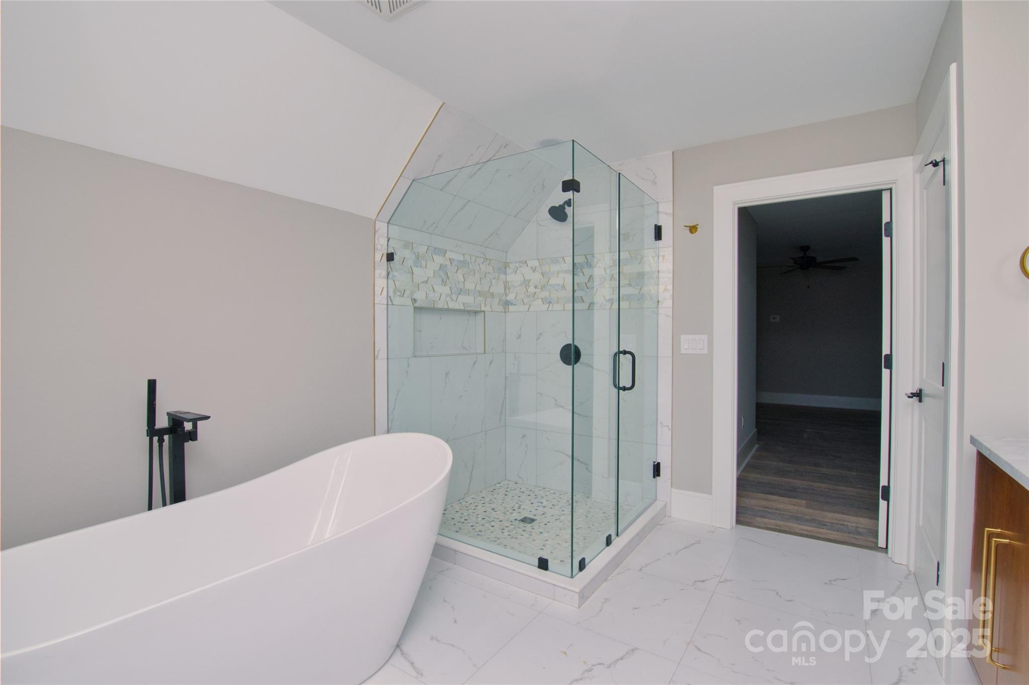 3905 Plainview Road Charlotte, NC 28208 - Photo 28 of 45 a bathroom with a tub and shower