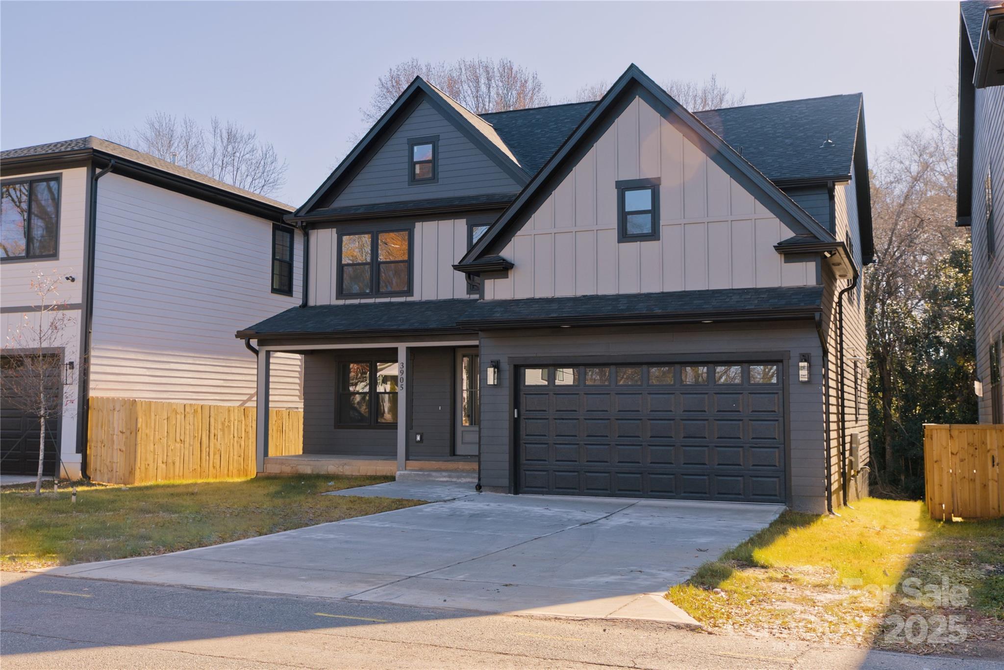 3905 Plainview Road Charlotte, NC 28208 - Photo 3 of 45 a front view of a house with a yard and garage