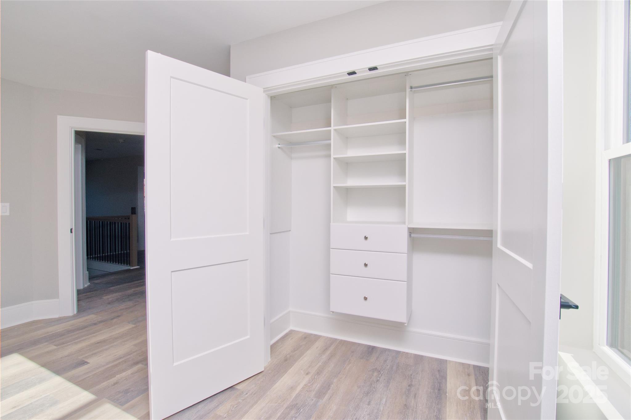 3905 Plainview Road Charlotte, NC 28208 - Photo 34 of 45 a view of walk in closet with empty racks