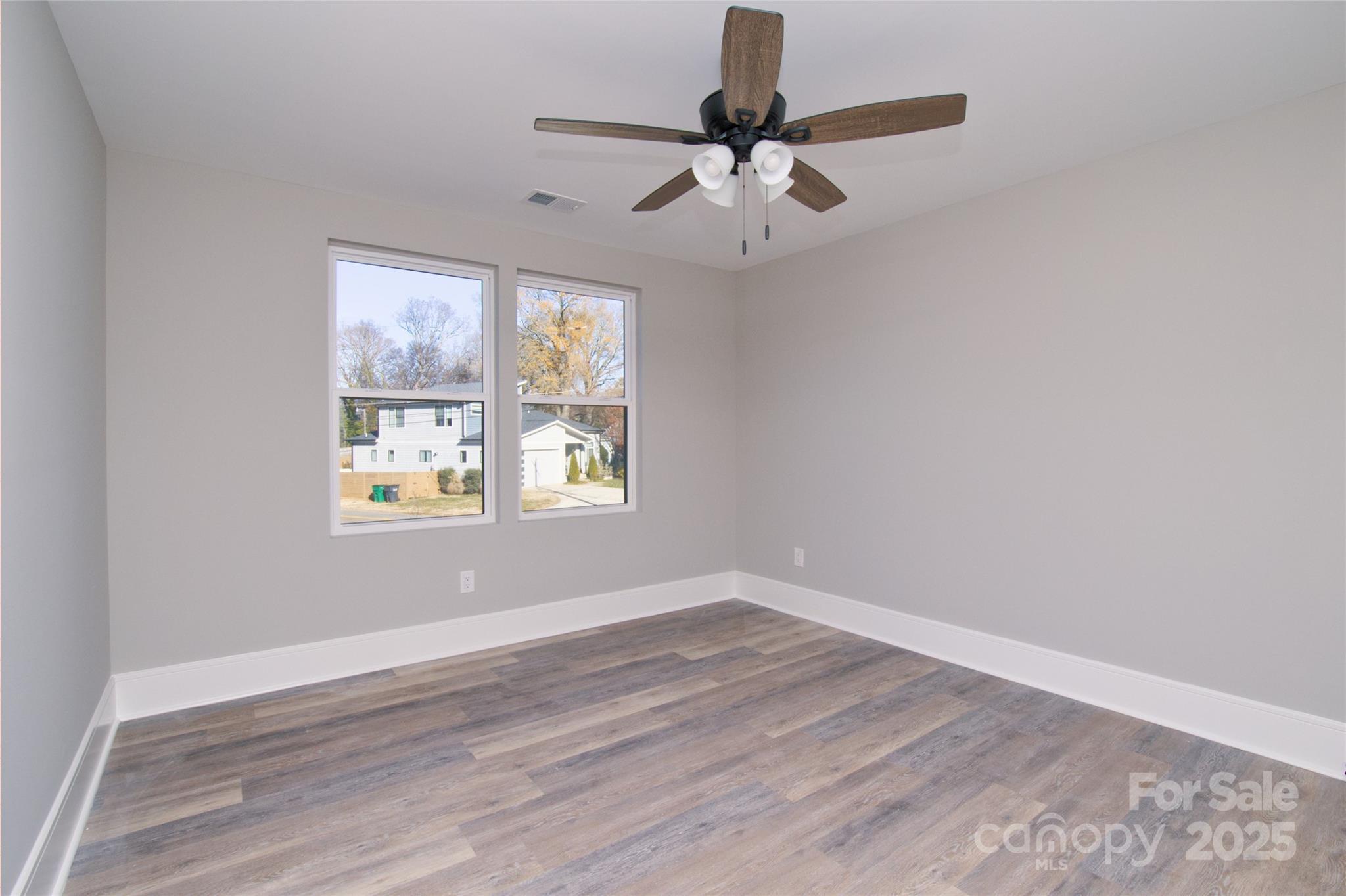 3905 Plainview Road Charlotte, NC 28208 - Photo 37 of 45 wooden floor in an empty room with a window