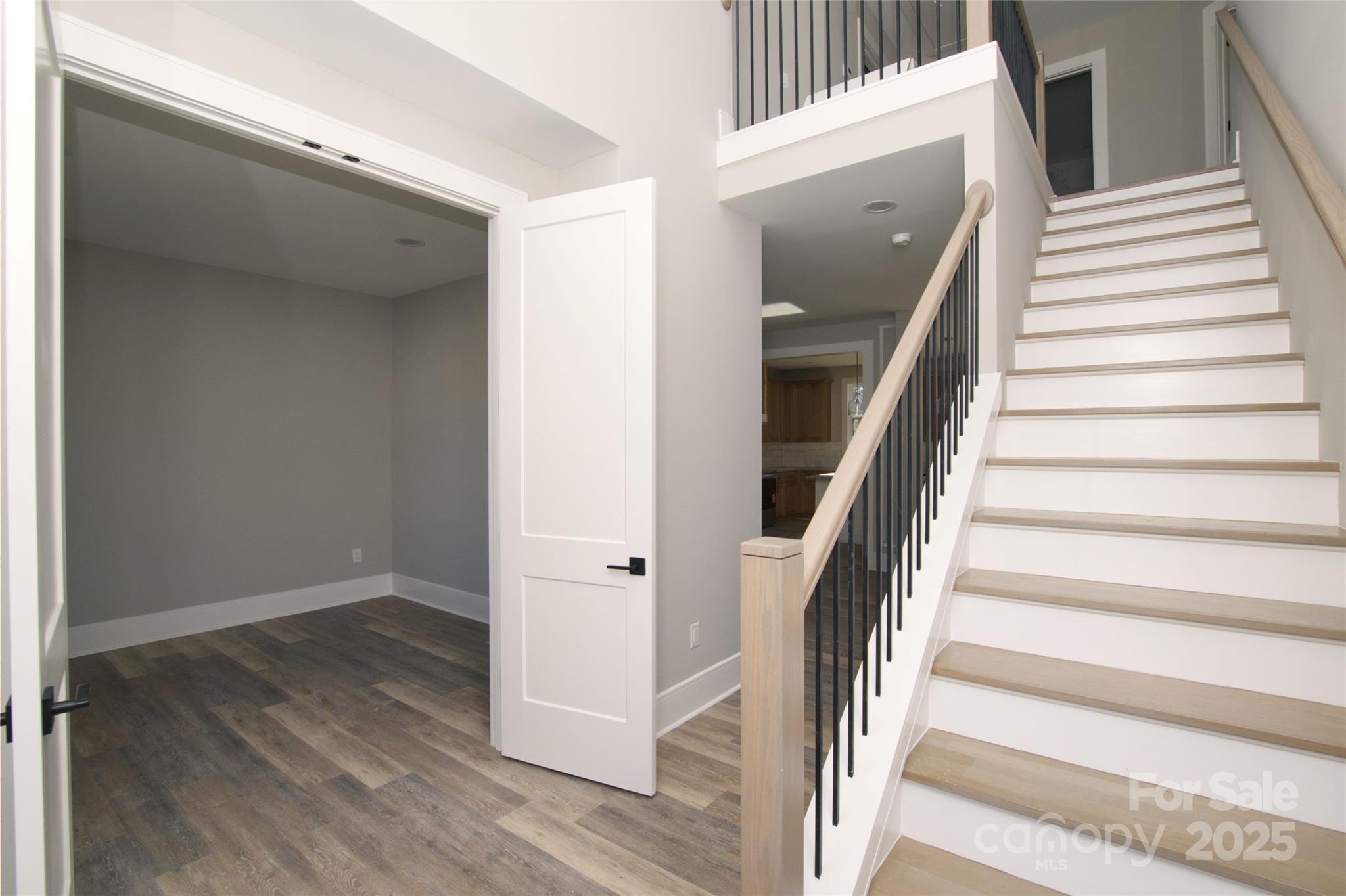 3905 Plainview Road Charlotte, NC 28208 - Photo 8 of 45 a view of entryway with wooden floor and stairs