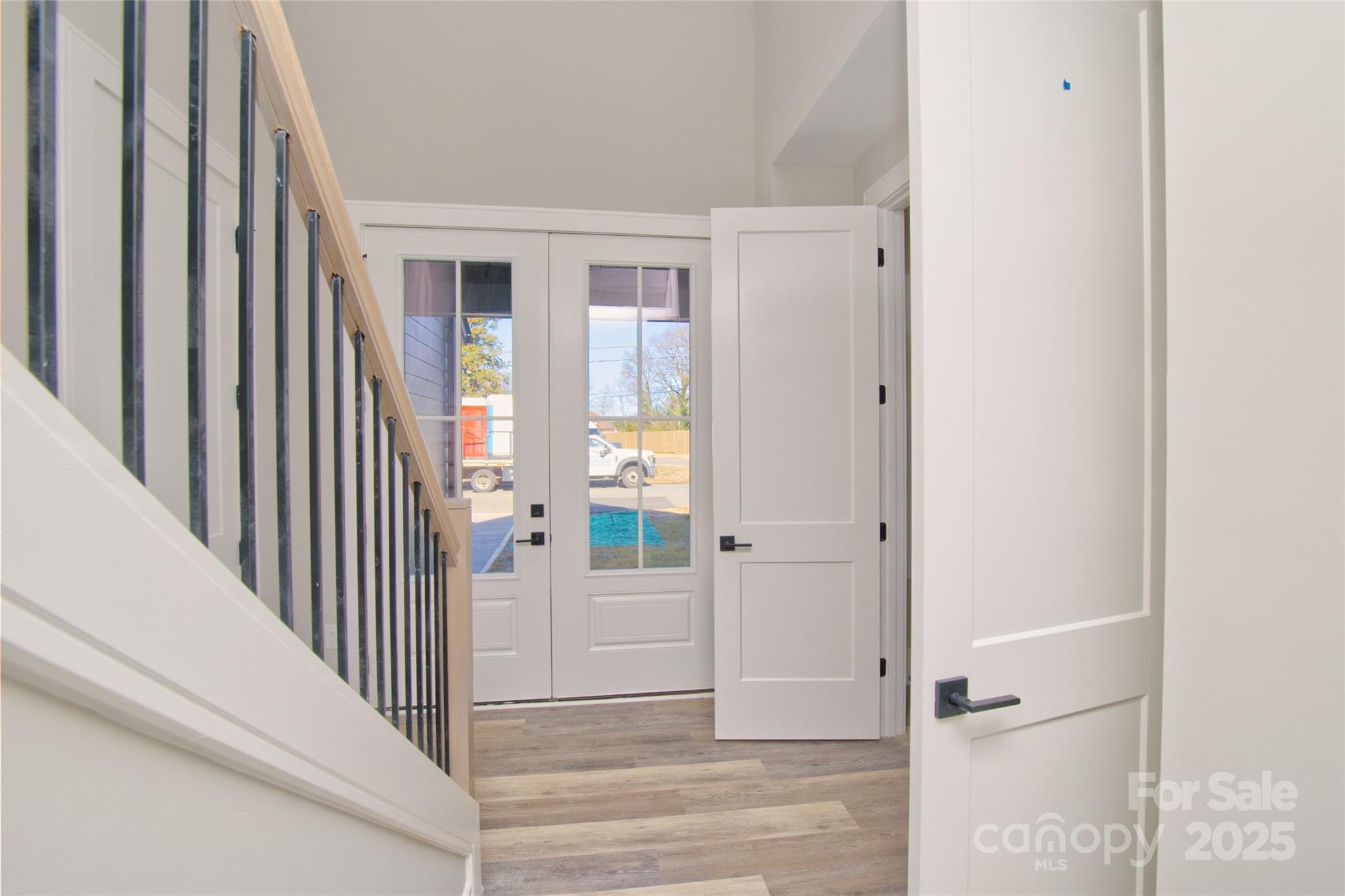 3905 Plainview Road Charlotte, NC 28208 - Photo 9 of 45 a view of a hallway with wooden floor and entryway