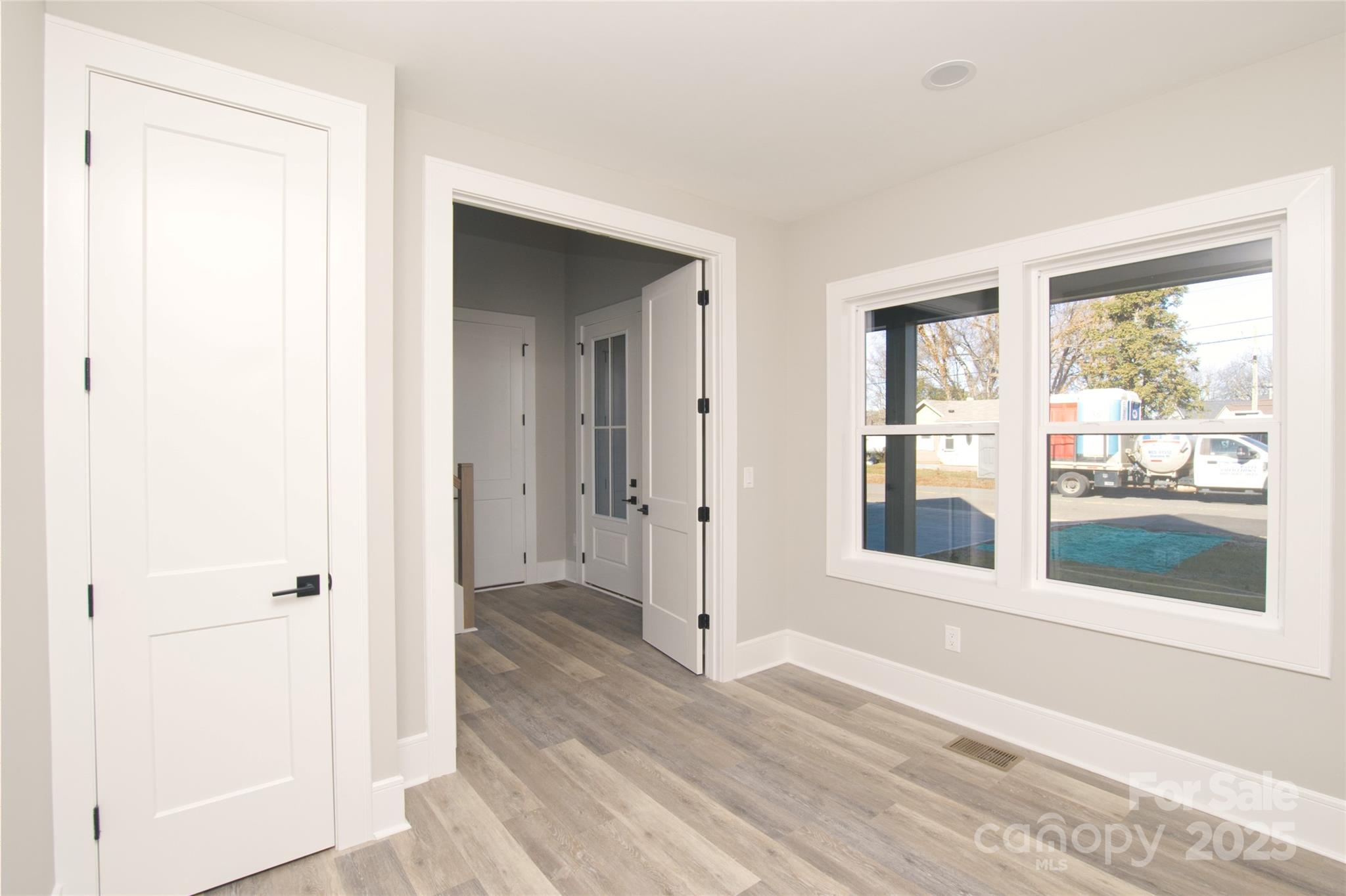 3905 Plainview Road Charlotte, NC 28208 - Photo 10 of 45 a view of a room with wooden floor and a window
