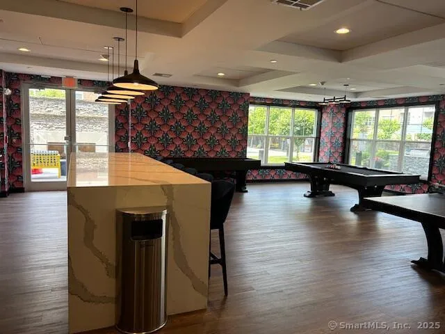 a lobby with furniture and floor to ceiling window