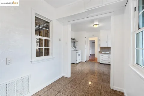 a view of kitchen with furniture and cabinets
