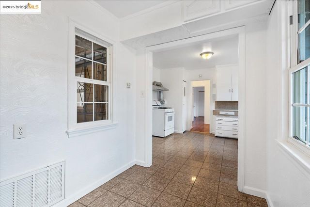 a view of kitchen with furniture and cabinets