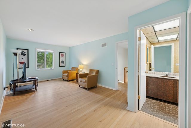 a bedroom with furniture and a window