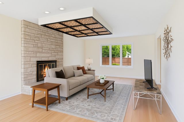 a living room with furniture a rug and a flat screen tv