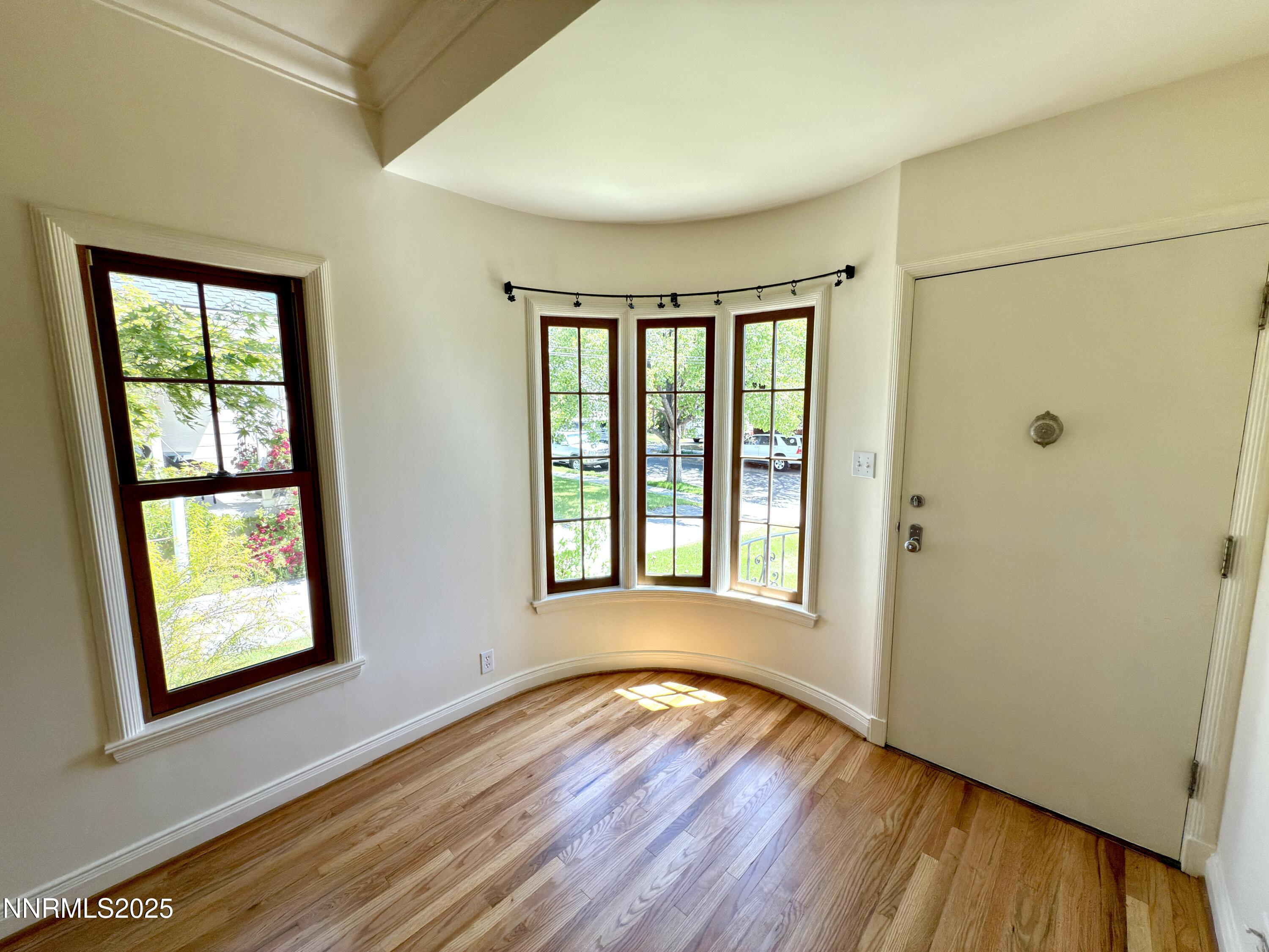 1423 Gordon Avenue Reno, NV 89509 - Photo 12 of 28 a view of an empty room with wooden floor and a window