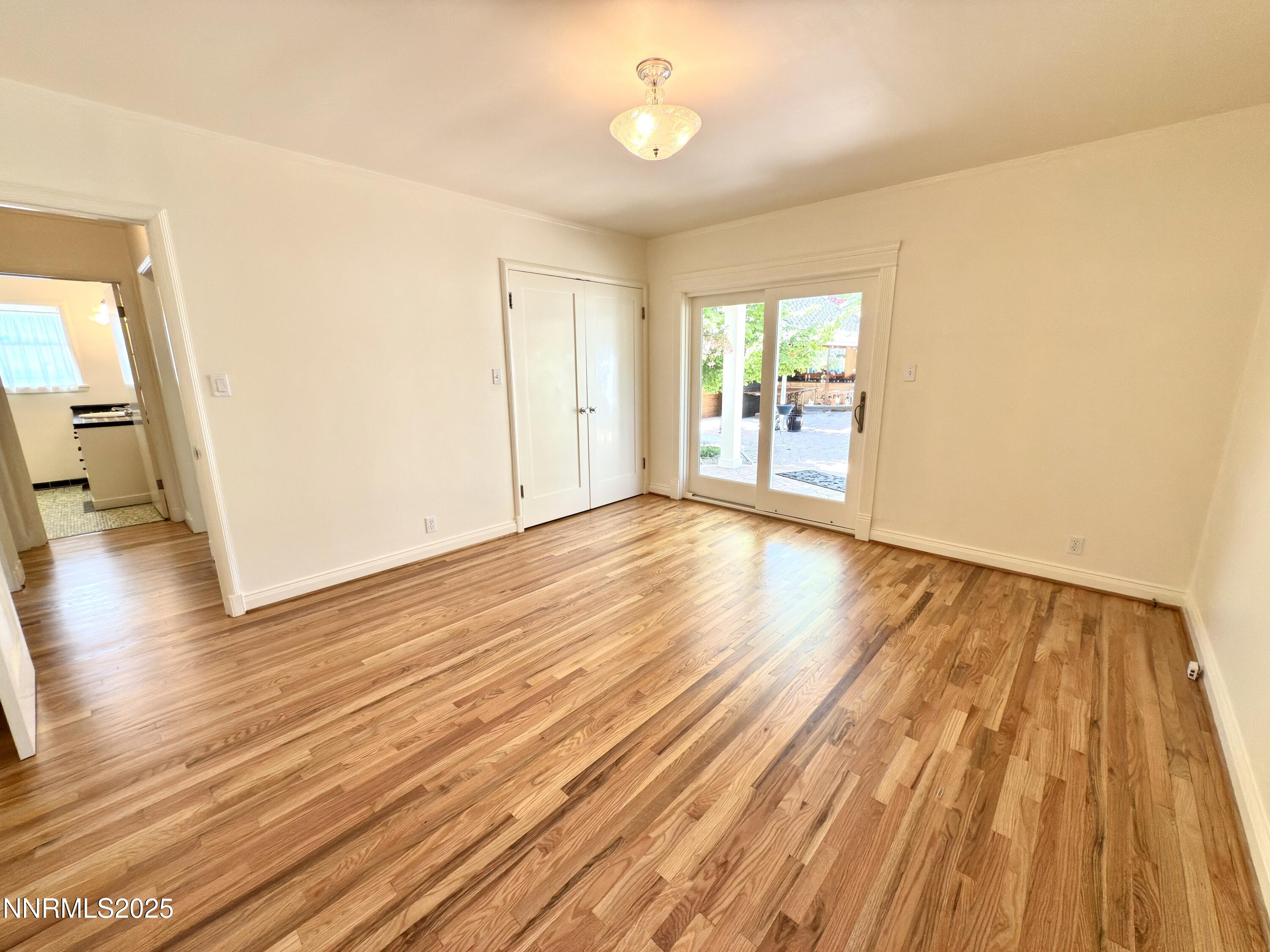 1423 Gordon Avenue Reno, NV 89509 - Photo 17 of 28 wooden floor in an empty room with a window