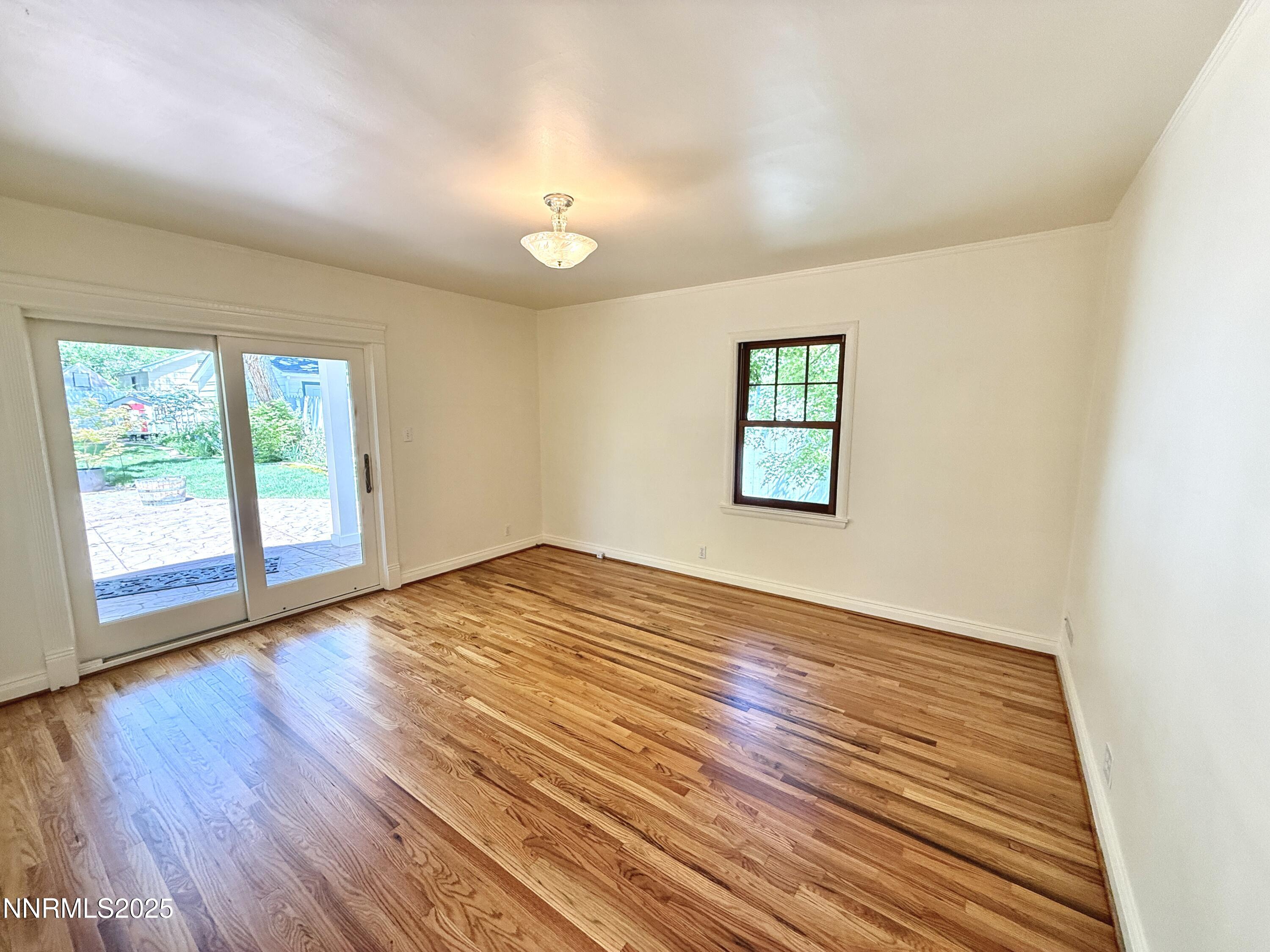 1423 Gordon Avenue Reno, NV 89509 - Photo 18 of 28 an empty room with wooden floor and windows