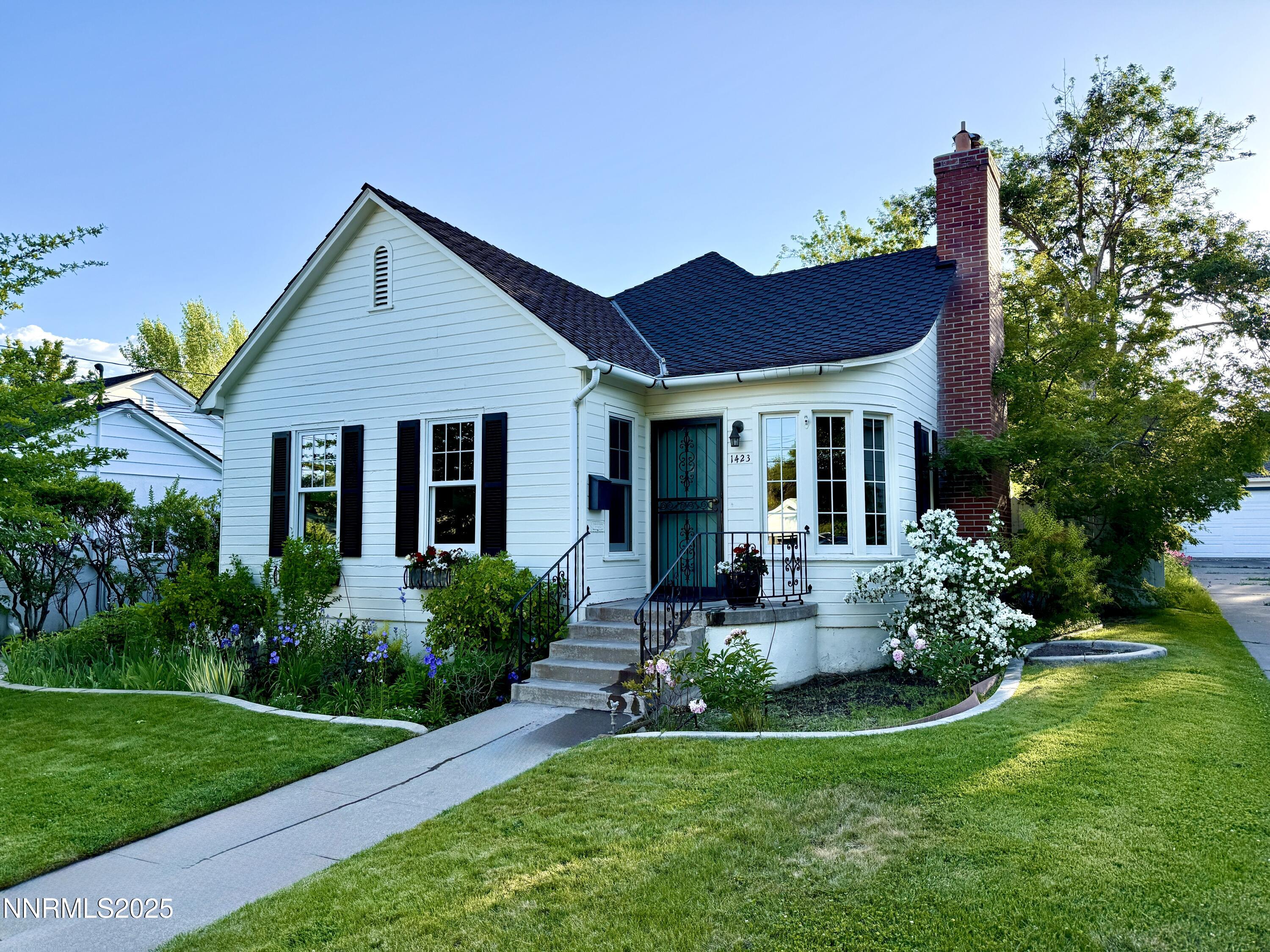 1423 Gordon Avenue Reno, NV 89509 - Photo 2 of 28 a front view of a house with porch and garden