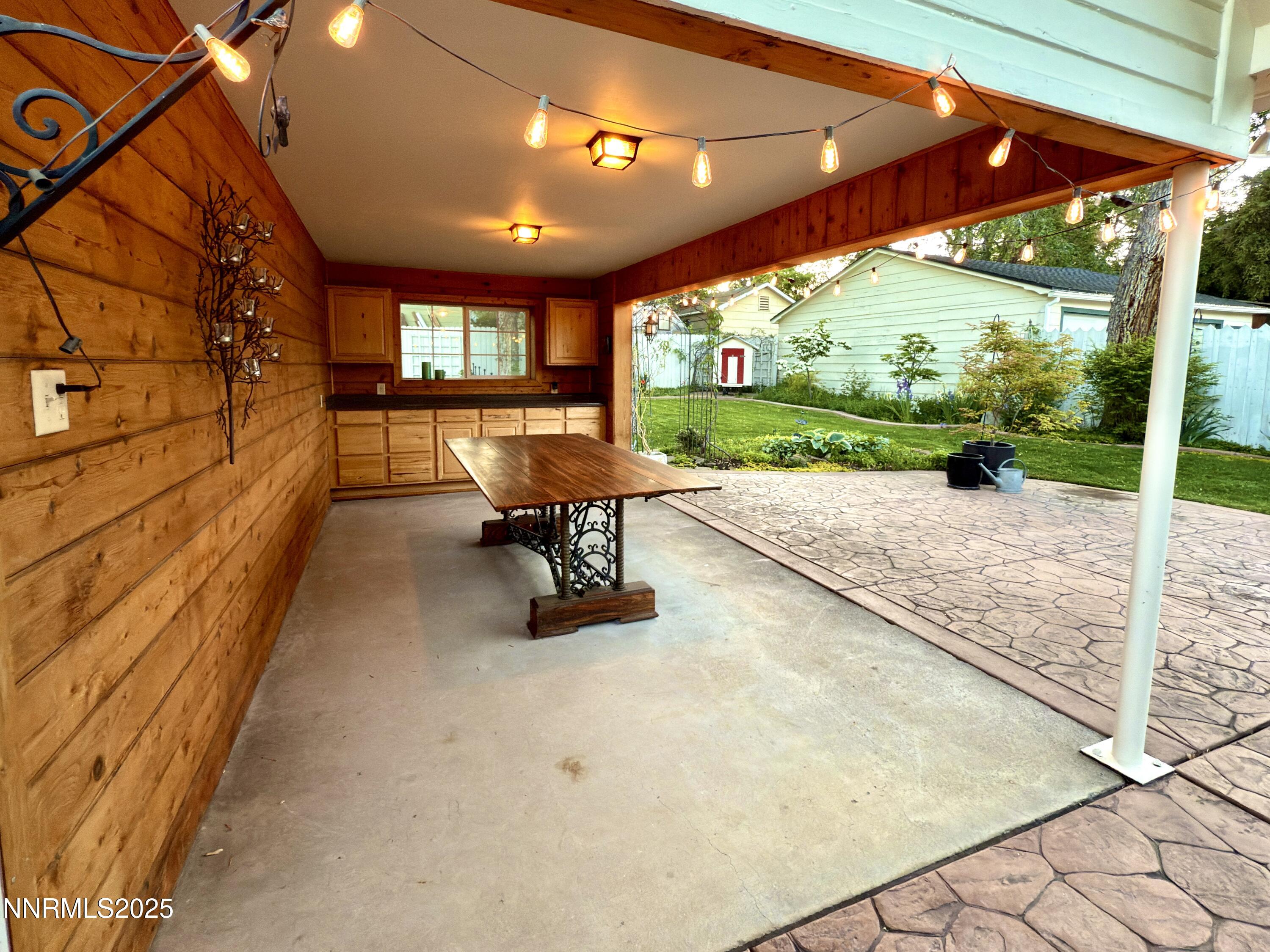 1423 Gordon Avenue Reno, NV 89509 - Photo 25 of 28 a view of a patio with table and chairs under an umbrella