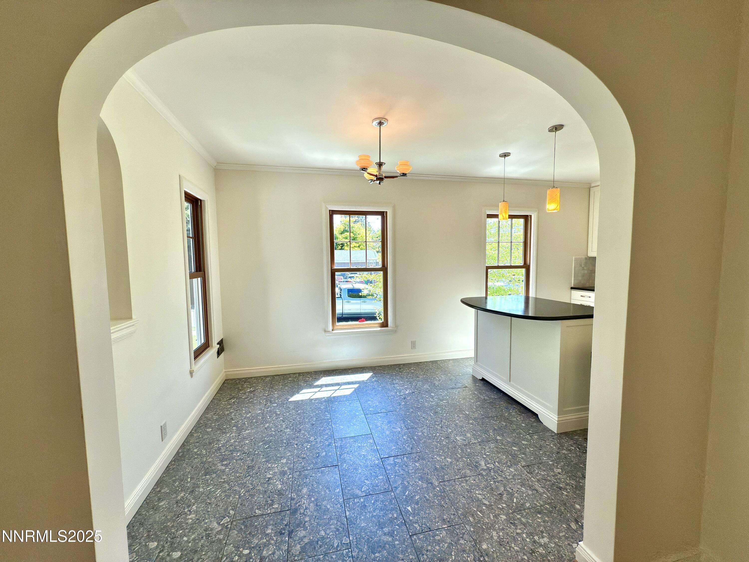 1423 Gordon Avenue Reno, NV 89509 - Photo 8 of 28 an empty room with windows and cabinet