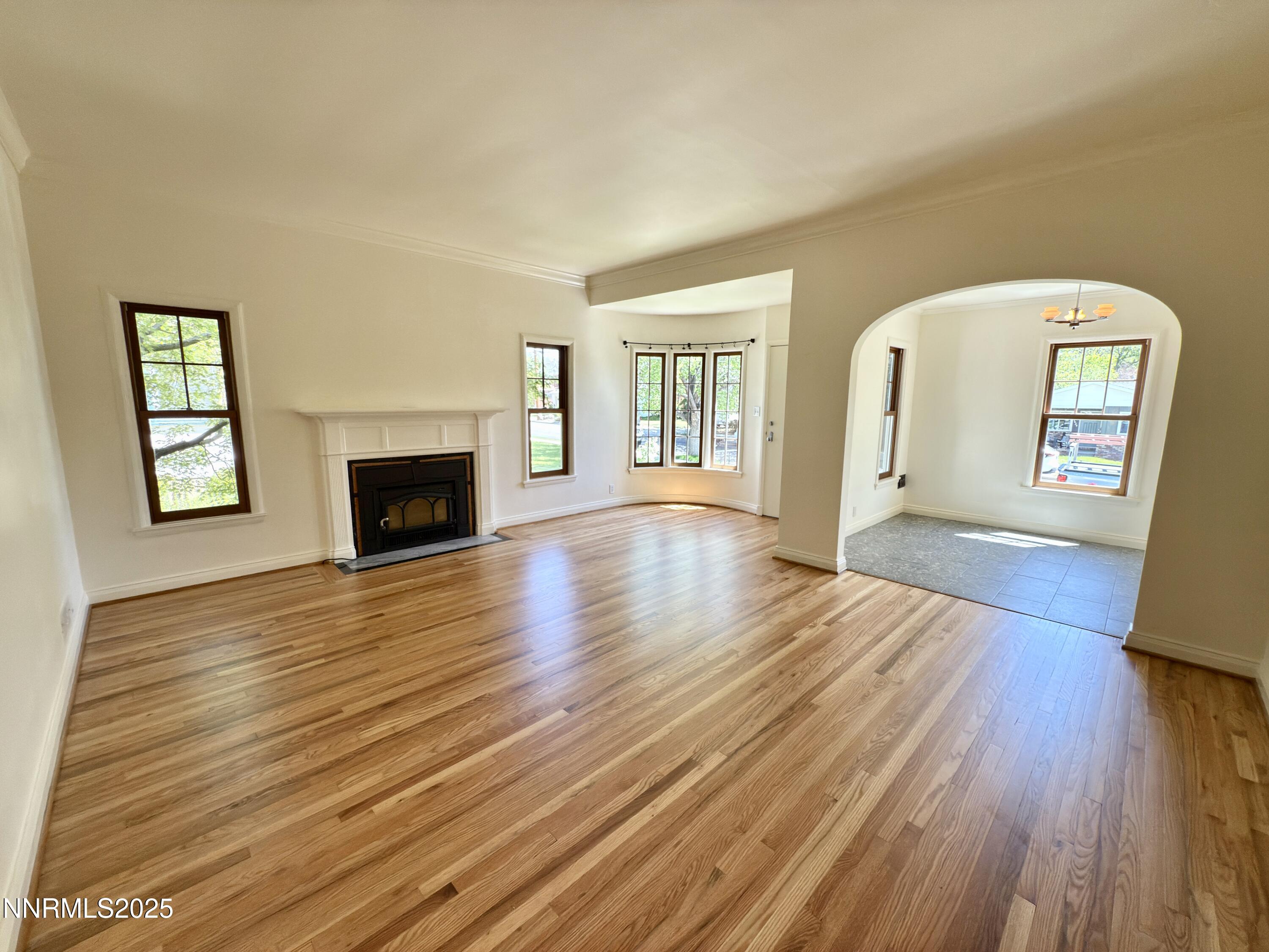 1423 Gordon Avenue Reno, NV 89509 - Photo 9 of 28 a view of an empty room with window and wooden floor