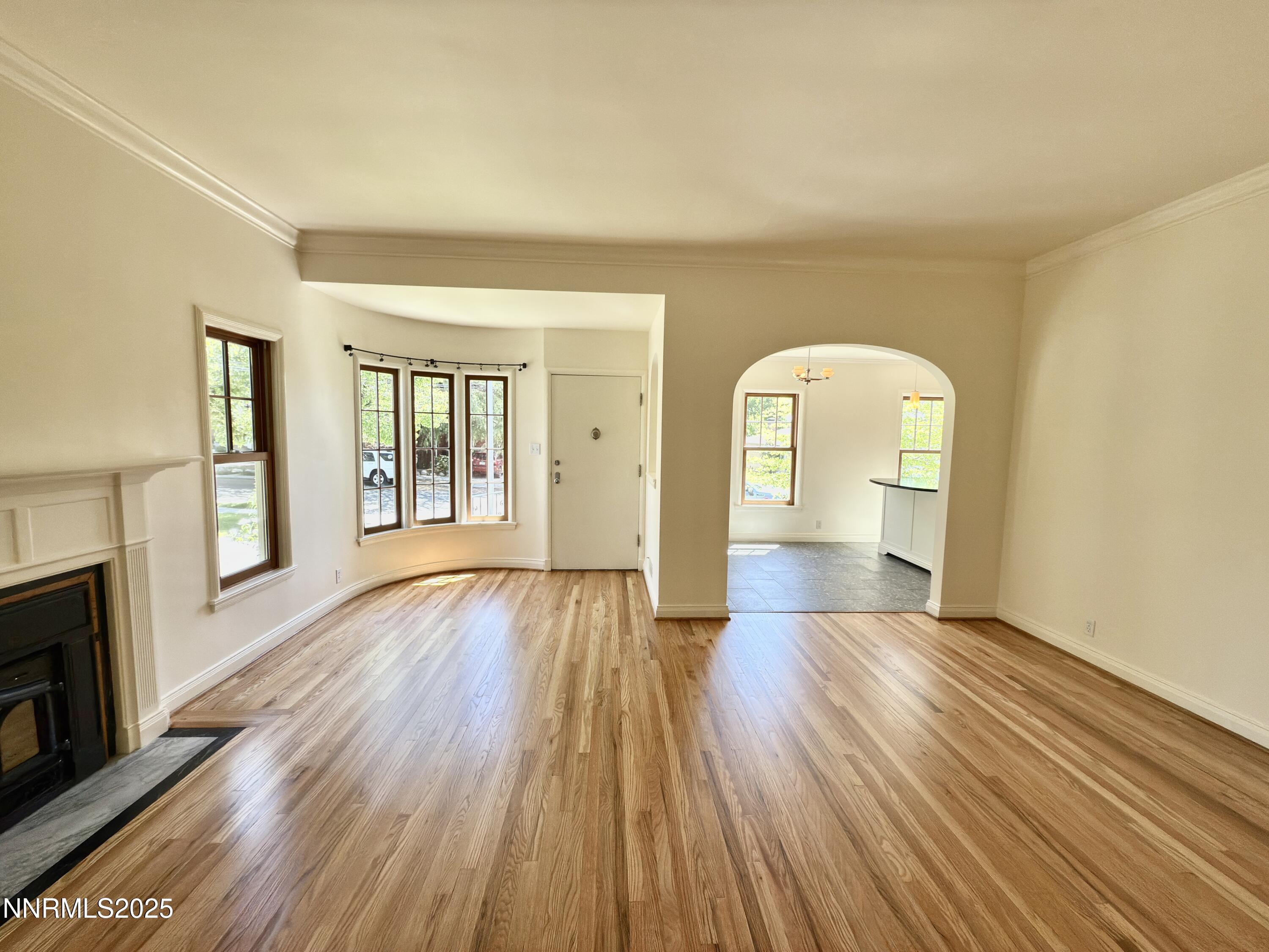 1423 Gordon Avenue Reno, NV 89509 - Photo 10 of 28 a view of a room with wooden floor and fireplace