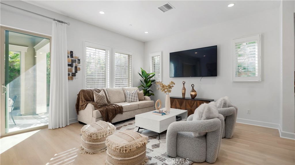 138 Jayhawk Irvine, CA 92602 - Photo 14 of 50 a living room with furniture and a flat screen tv