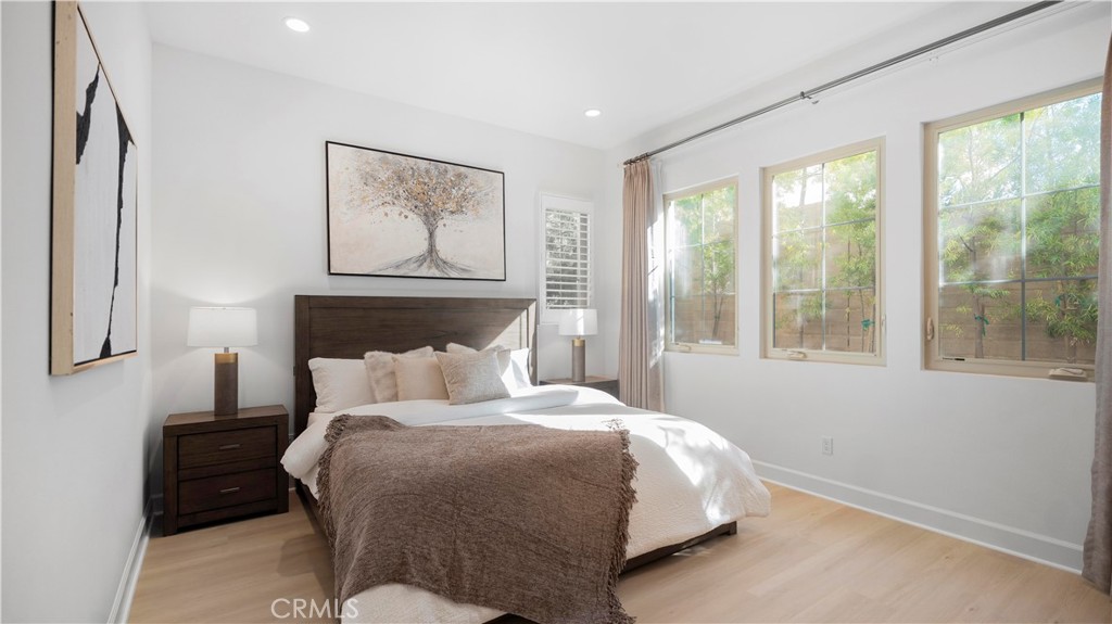 138 Jayhawk Irvine, CA 92602 - Photo 17 of 50 a bedroom with a large bed and a large window