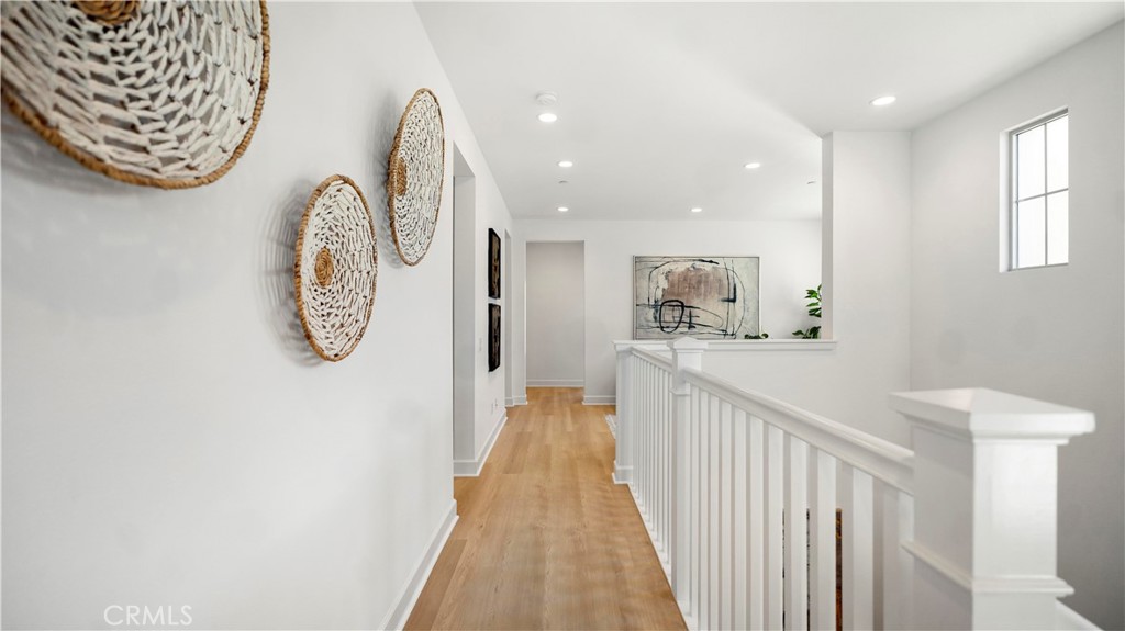 138 Jayhawk Irvine, CA 92602 - Photo 23 of 50 a view of a hallway with wooden floor
