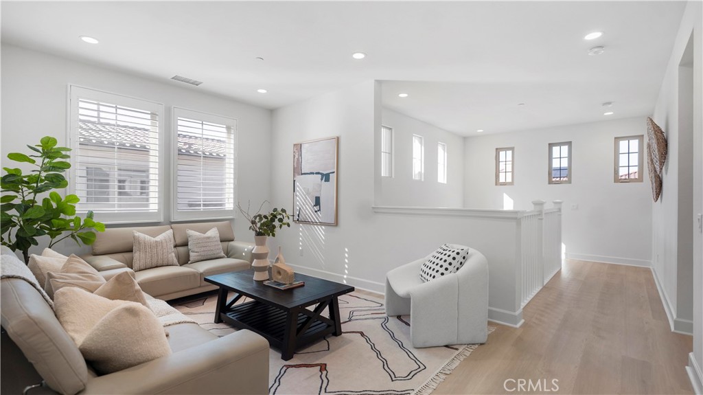 138 Jayhawk Irvine, CA 92602 - Photo 25 of 50 a living room with furniture and a large window