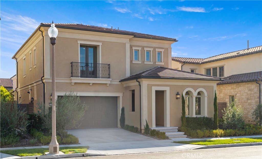 138 Jayhawk Irvine, CA 92602 - Photo 3 of 50 a front view of a house with garden