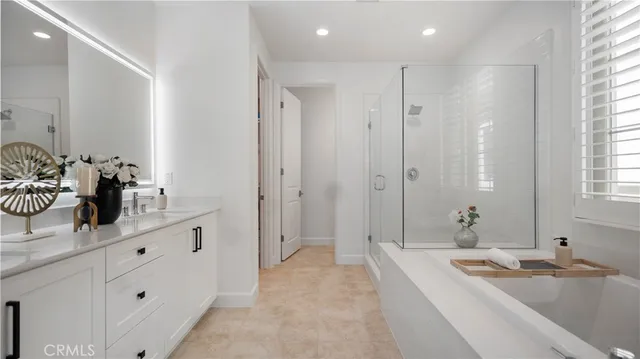 a bathroom with double sink and a mirror