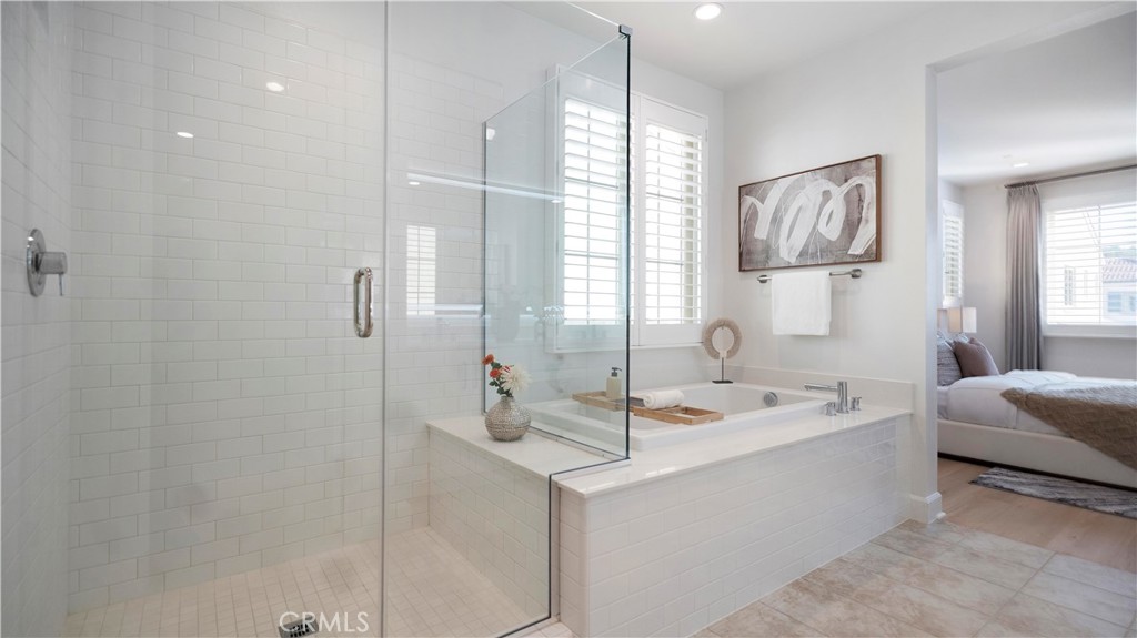 138 Jayhawk Irvine, CA 92602 - Photo 34 of 50 a en suite bathroom with a sink and a mirror