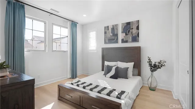 a bedroom with a bed and a mirror