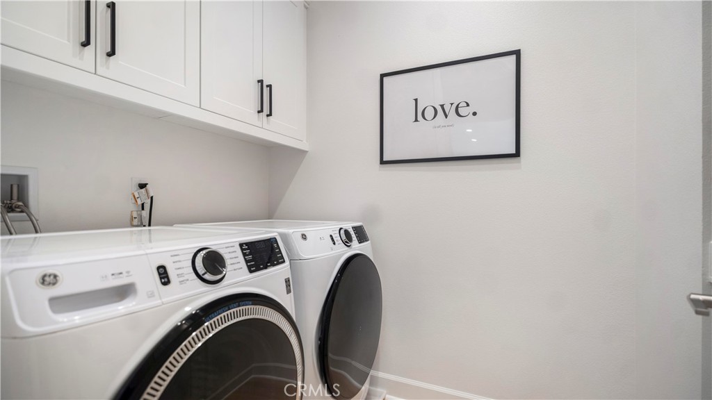 138 Jayhawk Irvine, CA 92602 - Photo 41 of 50 a view of storage and utility room with washer and dryer