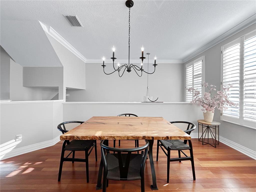 1468 Harbour Walk Road Tampa, FL 33602 - Photo 15 of 40 a view of a dining room with furniture window and wooden floor