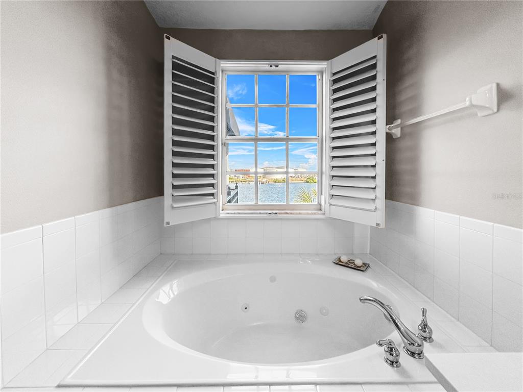 1468 Harbour Walk Road Tampa, FL 33602 - Photo 22 of 40 a bathroom with a bathtub and next to a window