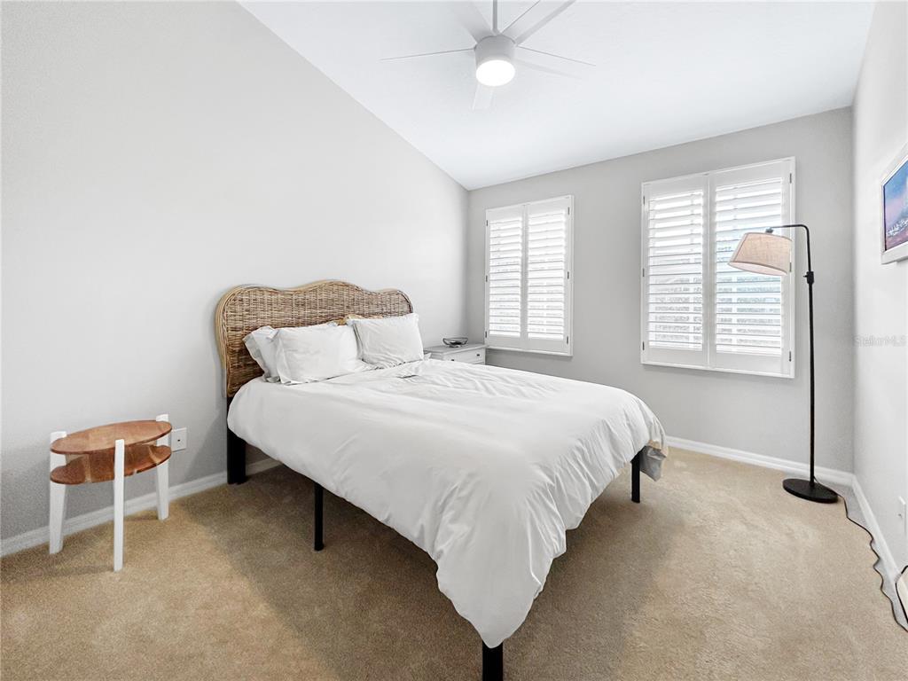 1468 Harbour Walk Road Tampa, FL 33602 - Photo 25 of 40 a bedroom with a bed and a chair