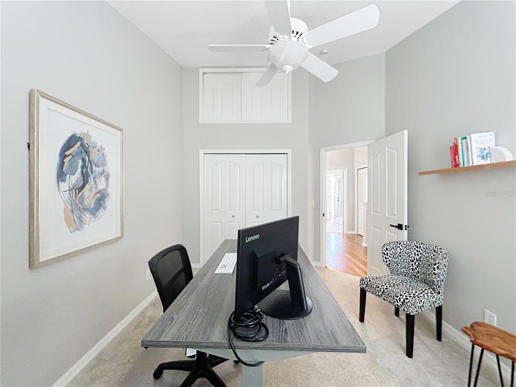 1468 Harbour Walk Road Tampa, FL 33602 - Photo 27 of 40 a living room with furniture and a chandelier