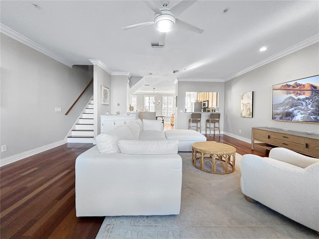 1468 Harbour Walk Road Tampa, FL 33602 - Photo 4 of 40 a living room with furniture and a chandelier