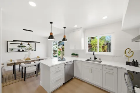 a kitchen with sink and window
