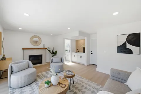 a living room with furniture and a fireplace