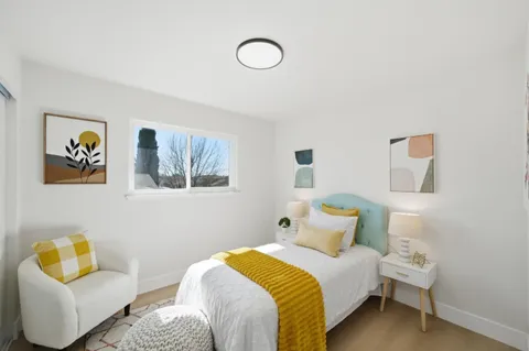 a bedroom with a bed and couch
