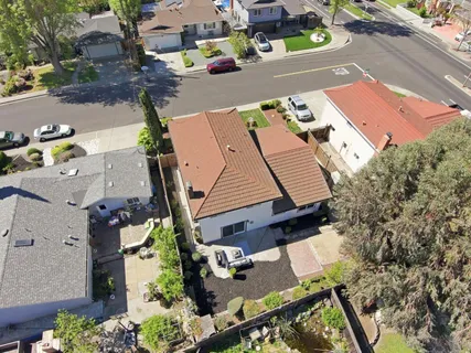 an aerial view of a house with a garden