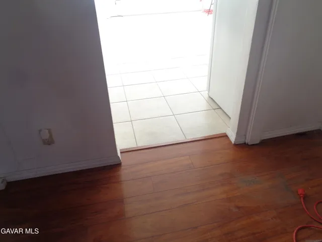 a white toilet sitting next to a shower curtain