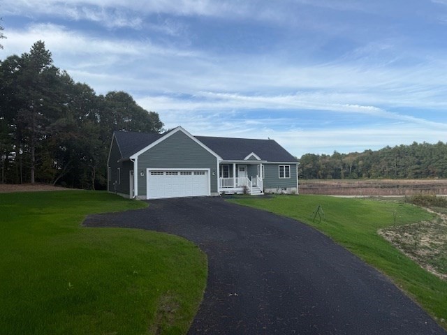 31 Cross Road Rochester, MA 02770 - Photo 5 of 8 a view of green field with house in background