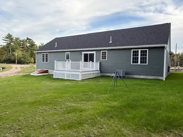 a balcony with wooden floor and fence