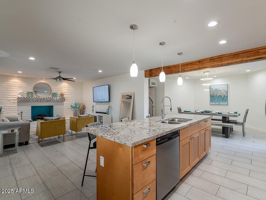 3302 East Turquoise Avenue Phoenix, AZ 85028 - Photo 15 of 59 a kitchen with stainless steel appliances granite countertop a sink and cabinets