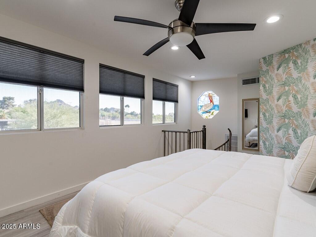3302 East Turquoise Avenue Phoenix, AZ 85028 - Photo 22 of 59 a large white bed in a bedroom next to a window