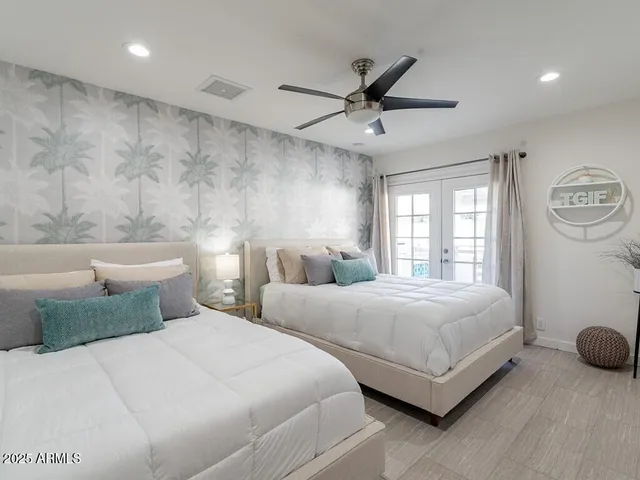 a bathroom with a granite countertop tub sink and mirror