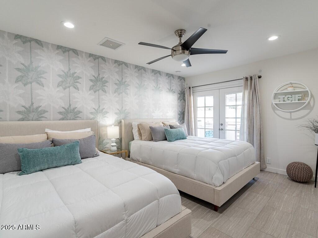 3302 East Turquoise Avenue Phoenix, AZ 85028 - Photo 26 of 59 a bedroom with two beds and a large window