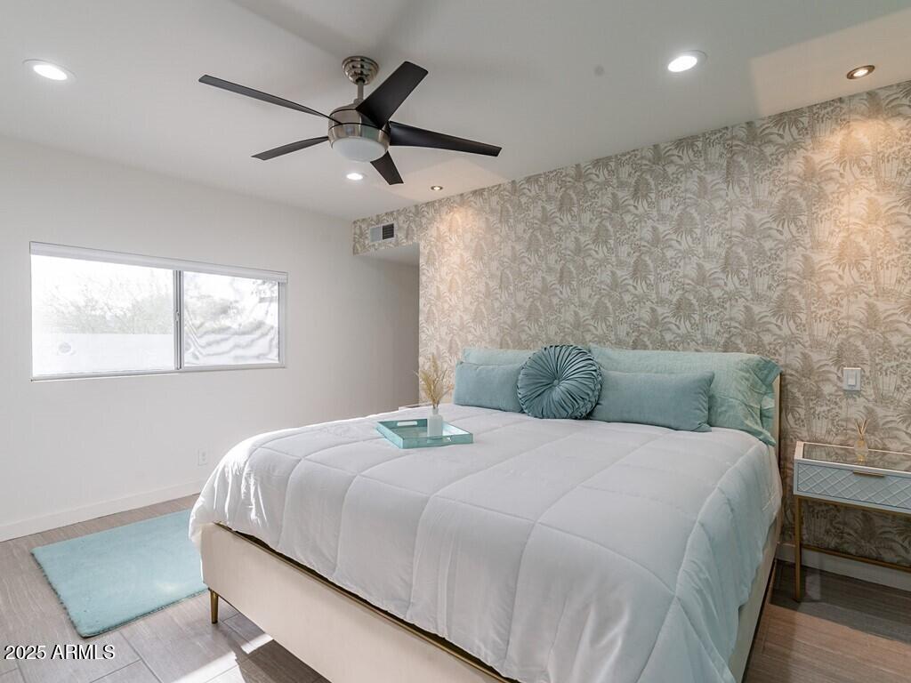 3302 East Turquoise Avenue Phoenix, AZ 85028 - Photo 33 of 59 a bedroom with a bed and window